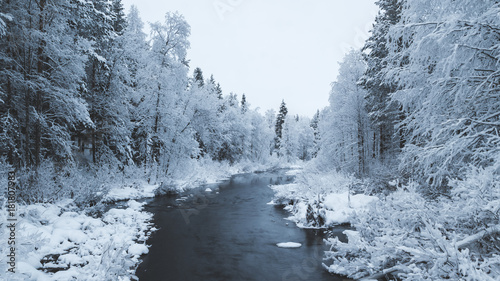 Snow and dark river