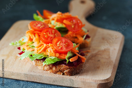 Healthy sandwich made of a fresh ciabbata with fresh vegan ingredients photo