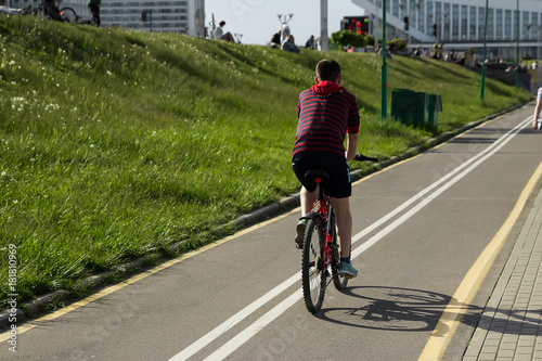 Speedy shadow - A cyclist at top speed on the triathlon race.