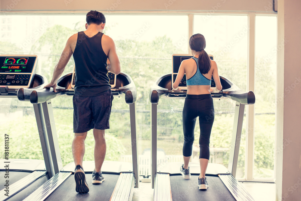 Fototapeta premium Portrait of People exercise at gym, People holding dumbbell for exercise at gym. Vintage Tone.
