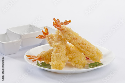 Tempura Jumbo Shrimps with salad and salsa dip on white plate and white background