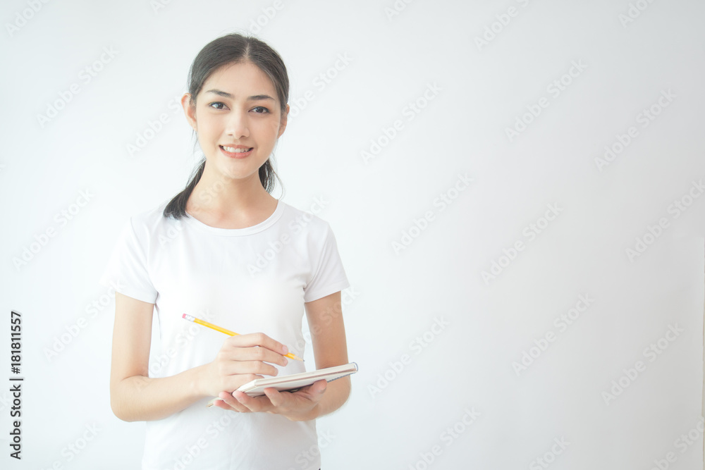 Portrait of Beautiful Young Asian Woman student holding book with attractive smiling isolated on white, Woman with Education Concept. Portrait of Beautiful Young Asian Woman student holding book with attractive smiling isolated on white, Woman with Education Concept.