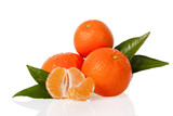 Orange Mandarines, Clementines, Tangerines or small oranges with one peeled and cut in half with leaves isolated on white background, cut out or cutout