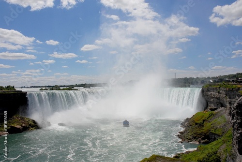 looking up the Niagara river towards a tourist boat approaching the Horseshoe Falls, Niagara Falls, Ontario Canada