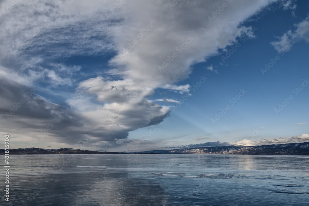 beautiful clouds over the ice of lake Baikal