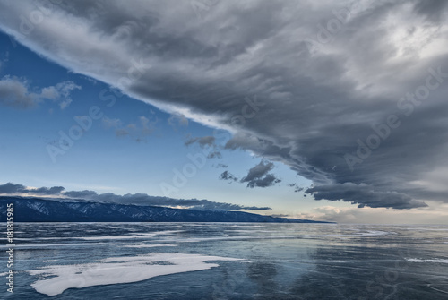 big cloud over the ice of lake Baikal © tashas