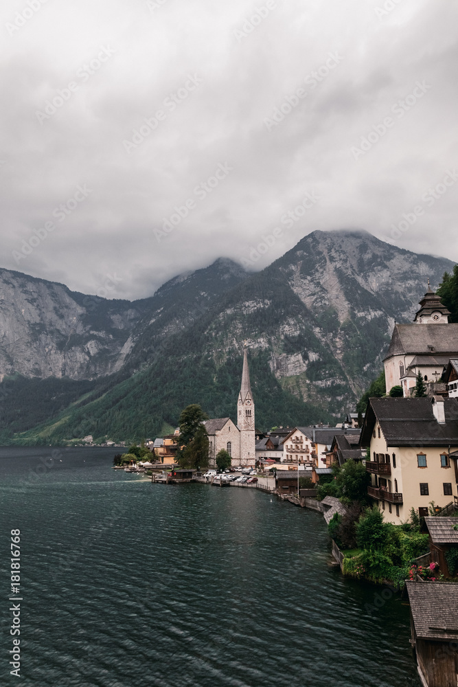 Scenic view of famous Hallstatt lakeside town reflecting in Hallstattersee lake in the Austrian Alps, Austria