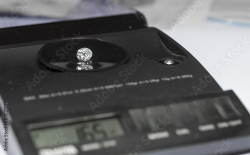 Diamond on the jewelry scales photo