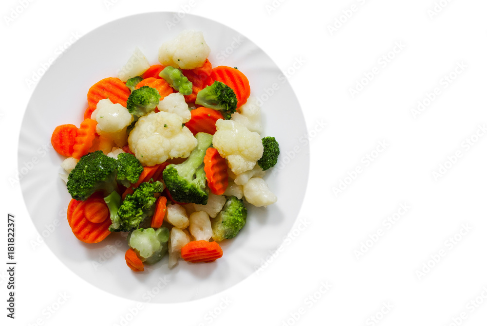 Mixed vegetables. cauliflower, broccoli and carrots in plate with copy space. top view. isolated on white Mixed vegetables. cauliflower, broccoli and carrots in plate with copy space. top view. isolated on white