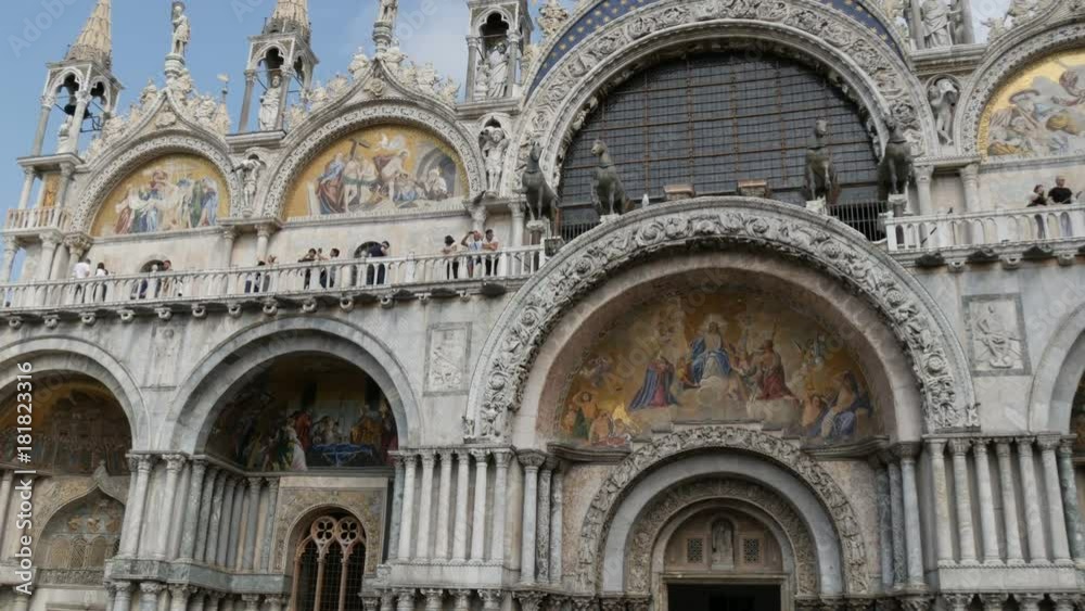 VENICE, ITALY, SEPTEMBER 7, 2017: View of main world-famous square of Venice, St. Mark's Cathedral, crowds of tourists stroll and watch the sights VENICE, ITALY, SEPTEMBER 7, 2017: View of main world-famous square of Venice, St. Mark's Cathedral, crowds of tourists stroll and watch the sights
