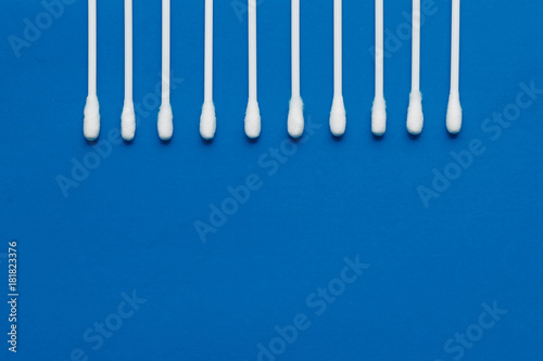 Hygienic  cotton buds on a blue background. The concept of hygiene  cleanliness.