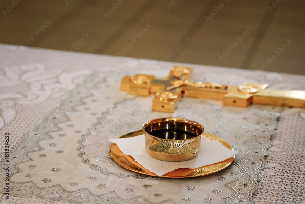 Silver, Golden cup of wine on the table in church. Communion. Close up. Silver, Golden cup of wine on the table in church. Communion. Close up.