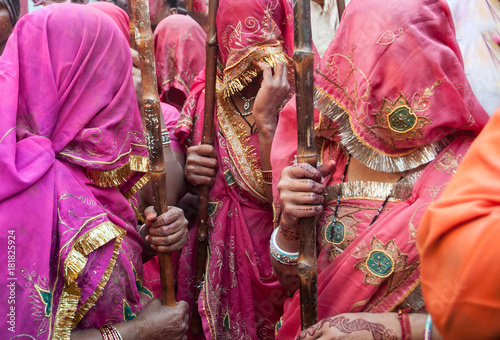 women in india dressed in traditional sari costumes during the holi festival in barsa and matura india photo