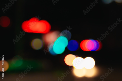 Blurred Christmas lights on a black background, bokeh. Light bokeh abstract. The concept of the new year 2018, holidays, vacation.