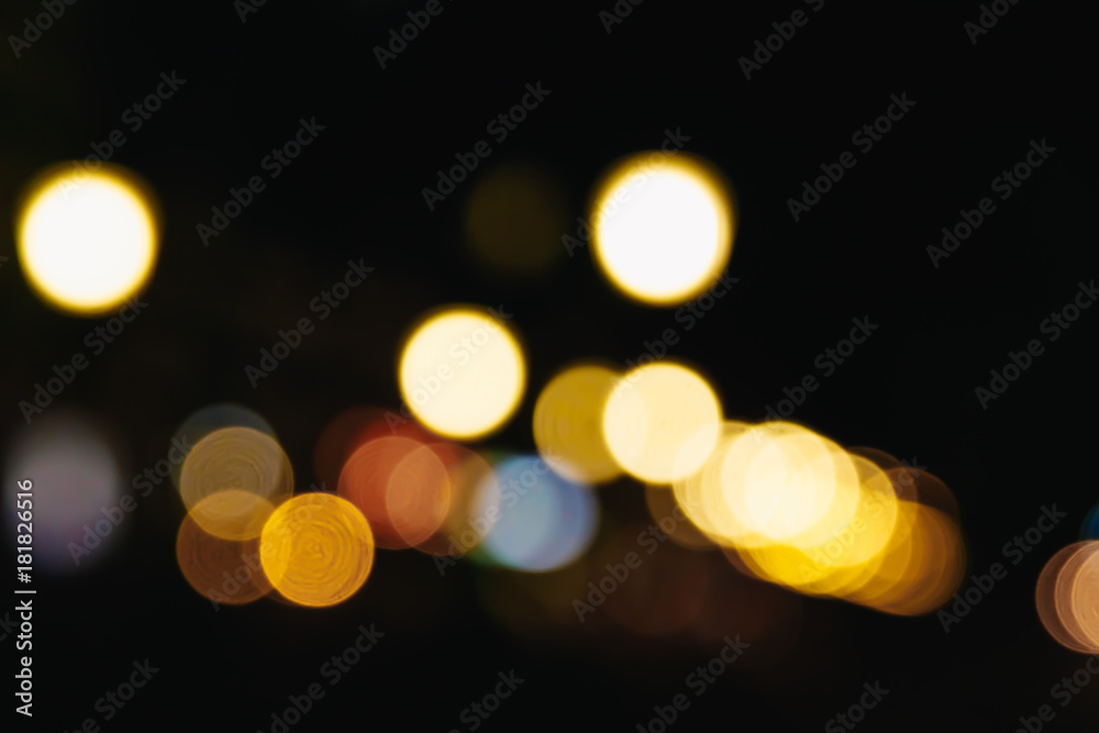Blurred Christmas lights on a black background, bokeh. Light bokeh abstract. The concept of the new year 2018, holidays, vacation.