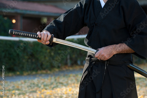 Iaido instructor draws his sword katana