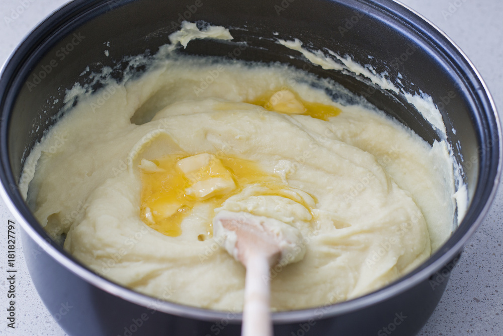 Some butter is melting in a creamy, steaming potato puree. Some butter is melting in a creamy, steaming potato puree.