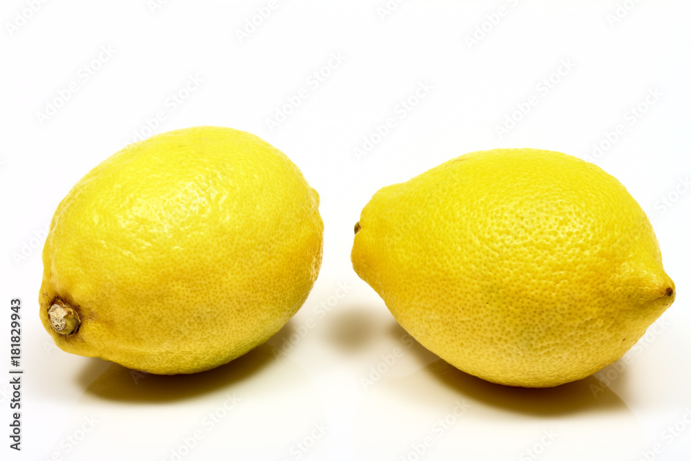 Studio shot image of juicy organic ripe lemons isolated on a white background Studio shot image of juicy organic ripe lemons isolated on a white background