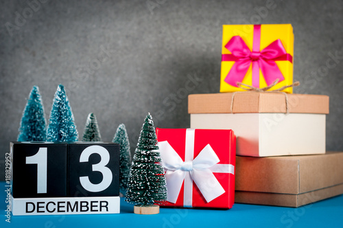 December 13th. Image 13 day of december month, calendar at christmas and new year background with gifts and little Christmas tree photo