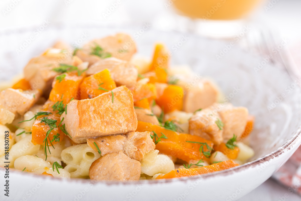 Braised chicken meat with carrot in sauce and pasta Braised chicken meat with carrot in sauce and pasta