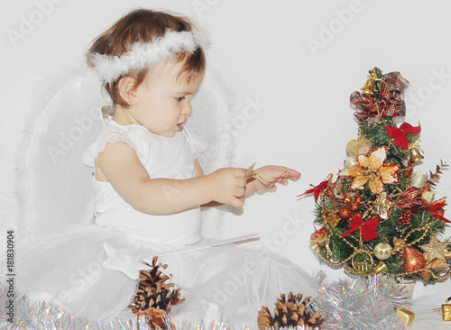 little child in the costume of an angel. Selective focus.   photo