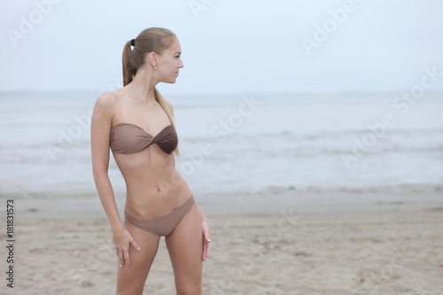 cute girl in bikini on the beach
