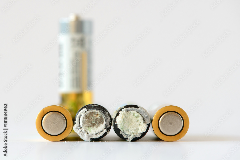 The old battery was leaking hazardous waste. Isolated background