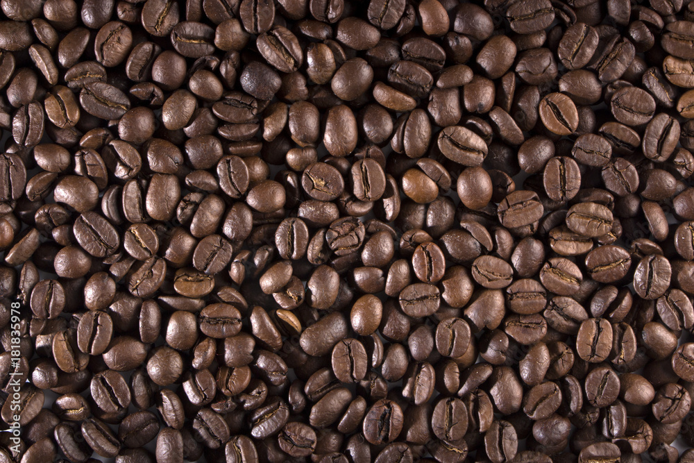 texture of coffee, with beautiful patches of light on the surface of grains texture of coffee, with beautiful patches of light on the surface of grains