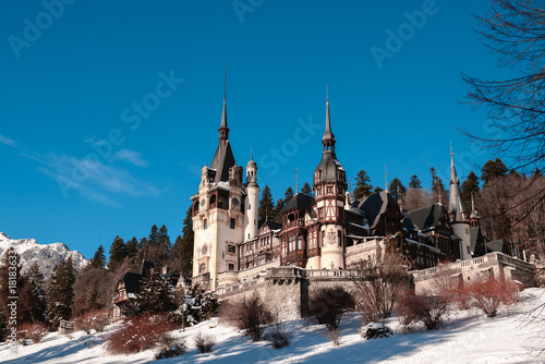 View to the Peles Castle during the winter season. Sunny day and clear sky. Romania, Sinaia.