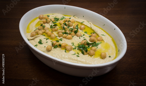 Traditional Middle east Hummus with herbs, seasoned with extra virgin olive oil