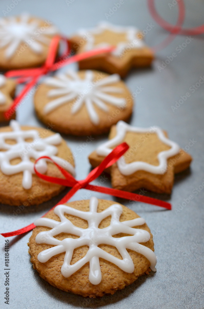 Festive cookies on stone background with red bows