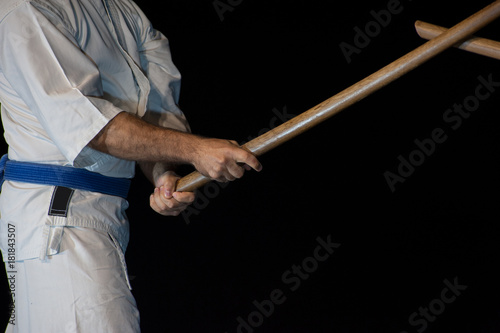 Blue belt aikido fighter in attack position