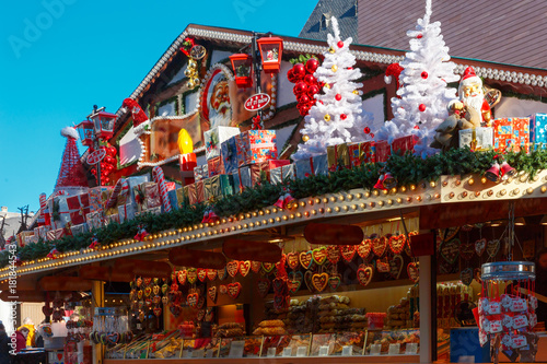Santa Claus, Christmas tree and toys at a Christmas souvenir market shop in Strasbourg, Alsace, France