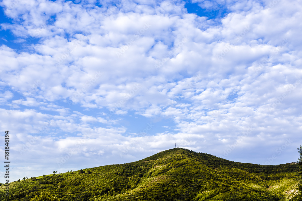 green hill on the background of a beautiful sky