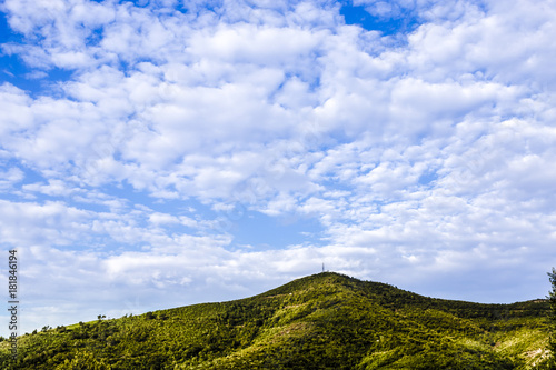 green hill on the background of a beautiful sky