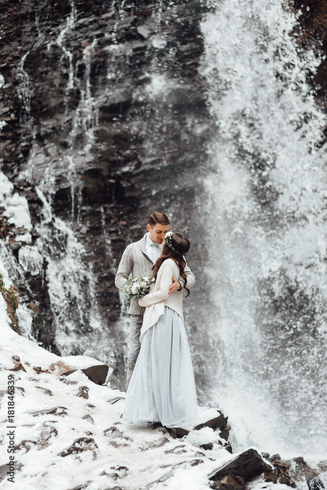bride and groom on the mountain waterfall bride and groom on the mountain waterfall