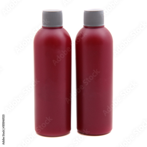 two red bottles on a white background