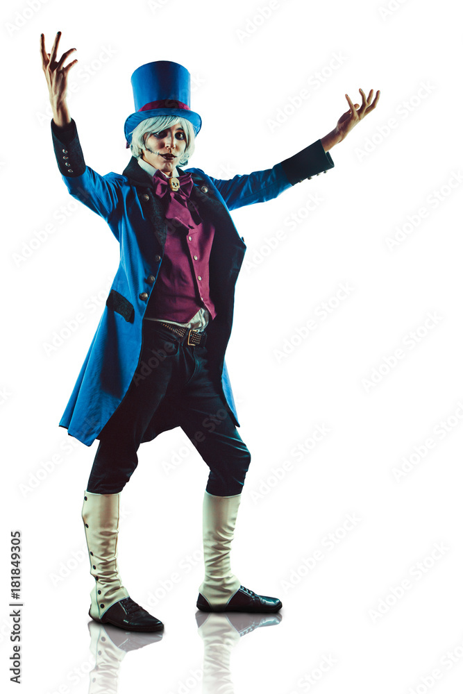 Smiling circus actor in blue tuxedo is presenting something. Smiling circus actor in blue tuxedo is presenting something.