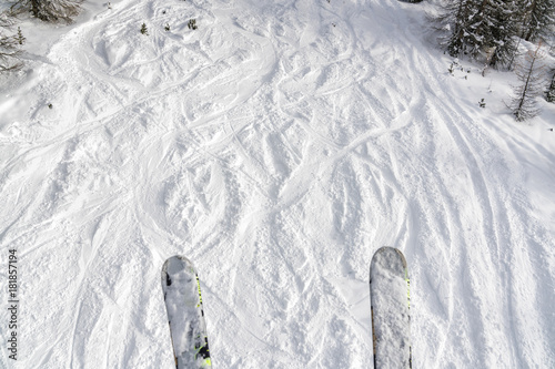 Ski and snowboard free ride tracks in fresh powder snow. POV vieved from the ski lift photo