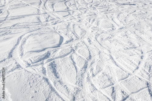 Snowboard free ride tracks in powder snow. Winter season