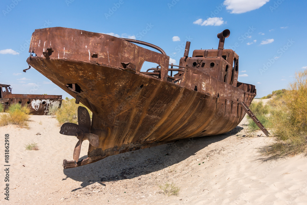 Rusted abandoned vessel in the ship cemetery of Aral Sea, Muynak, Uzbekistan Rusted abandoned vessel in the ship cemetery of Aral Sea, Muynak, Uzbekistan