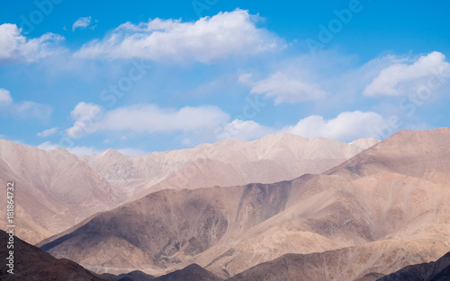 Closeup image of mountains and blue sky with clouds background in Ladakh , India