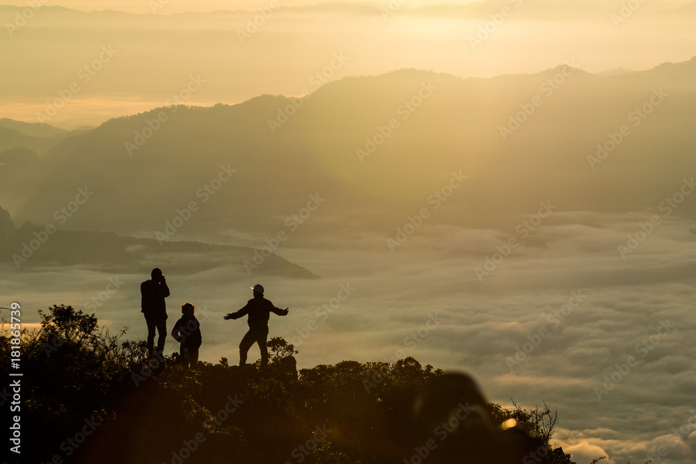 Obraz premium Silhouette of group people standing on the mountain and take photos at sunrise., at Doi Luang Chiang Dao Chiang Mai Thailand, silhouette concept