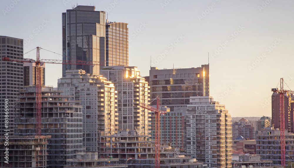 Modern high rise buildings and new structures with cranes in the city of Calgary