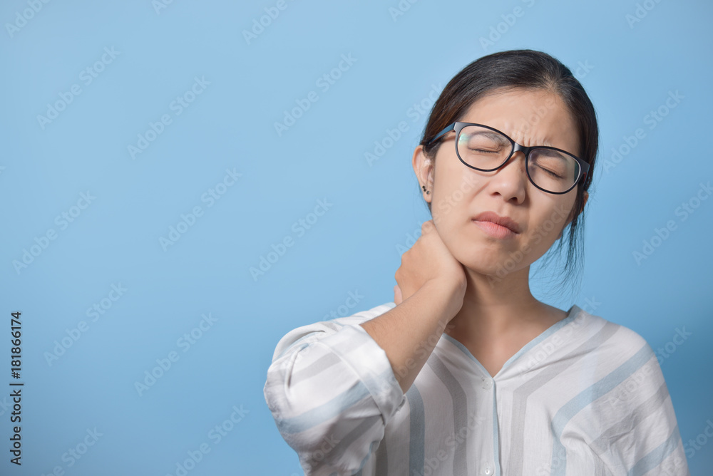Asian woman standing and having neck pain. Asian woman standing and having neck pain.
