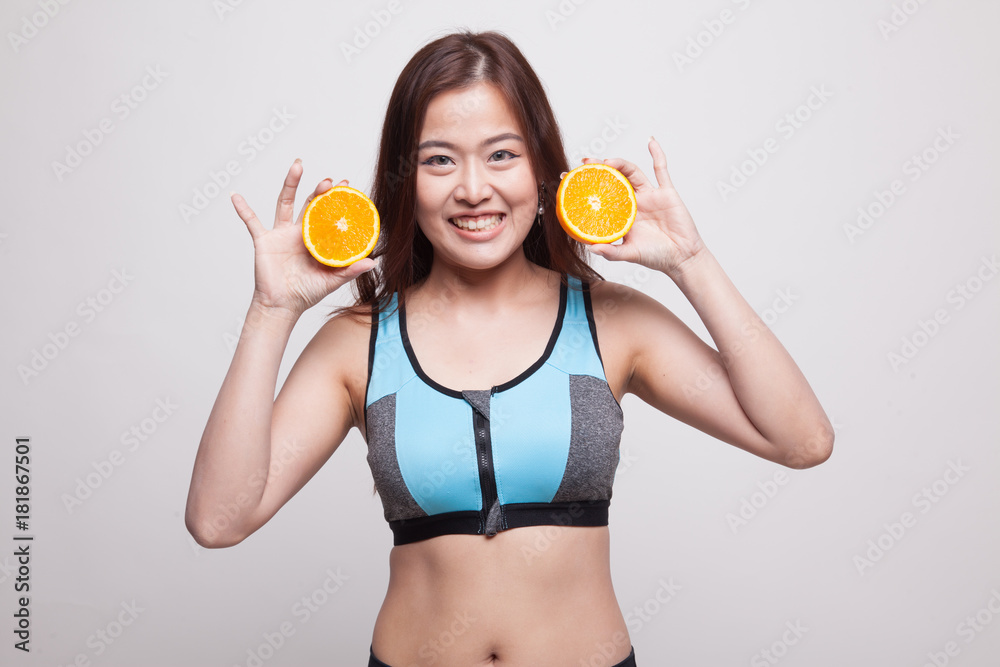 Beautiful Asian healthy girl with orange fruit. Beautiful Asian healthy girl with orange fruit.
