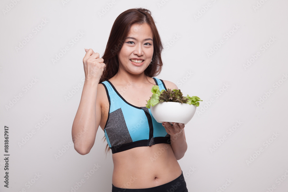 Beautiful Asian healthy girl fist up with salad. Beautiful Asian healthy girl fist up with salad.