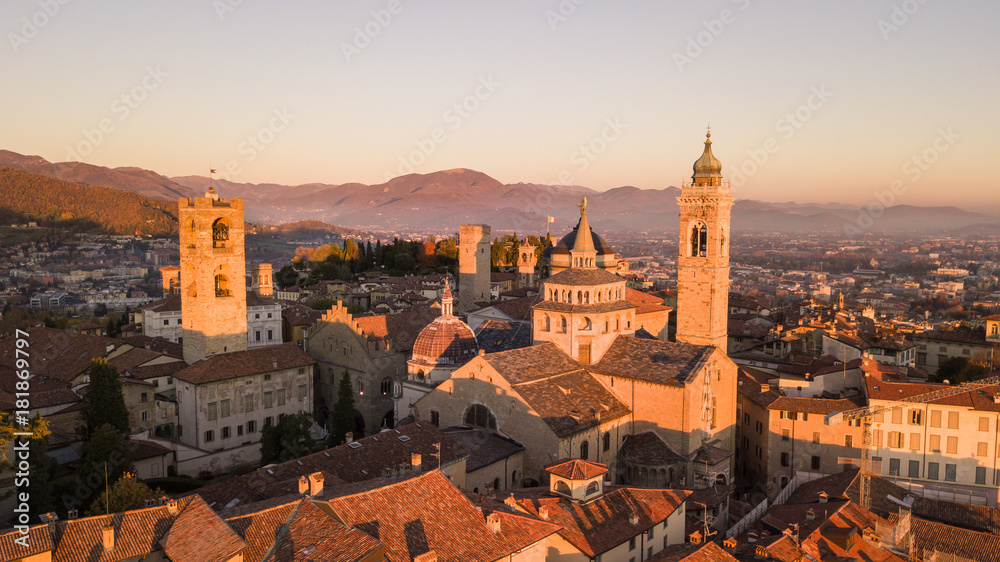 Bergamo, Italy. Drone aerial view of the Old city. One of the beautiful city in Italy. Landscape on the city center and the historical buildings during the sunset