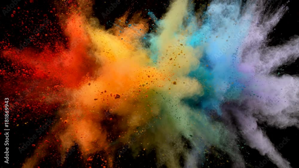 Colorful powder/particles fly after being exploded against black background. Shot with high speed camera, phantom flex 4K. Slow Motion.