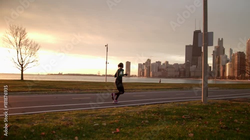 Woman is running in the park. Morning Sunrise.